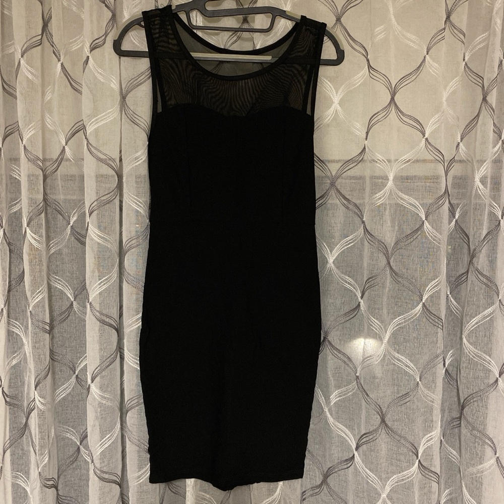 Small black mesh sleeveless dress.